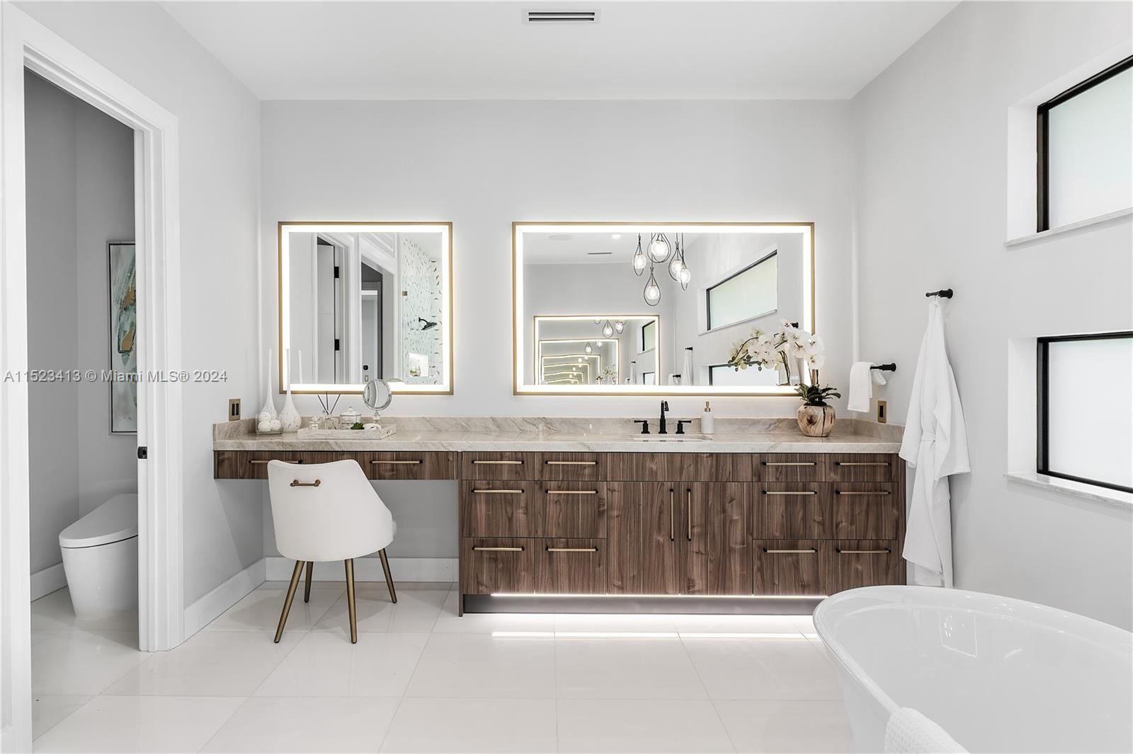 364 Northeast 6th Street Boca Raton, FL 33432 - Photo 42 of 80 a spacious bathroom with a granite countertop sink and a mirror