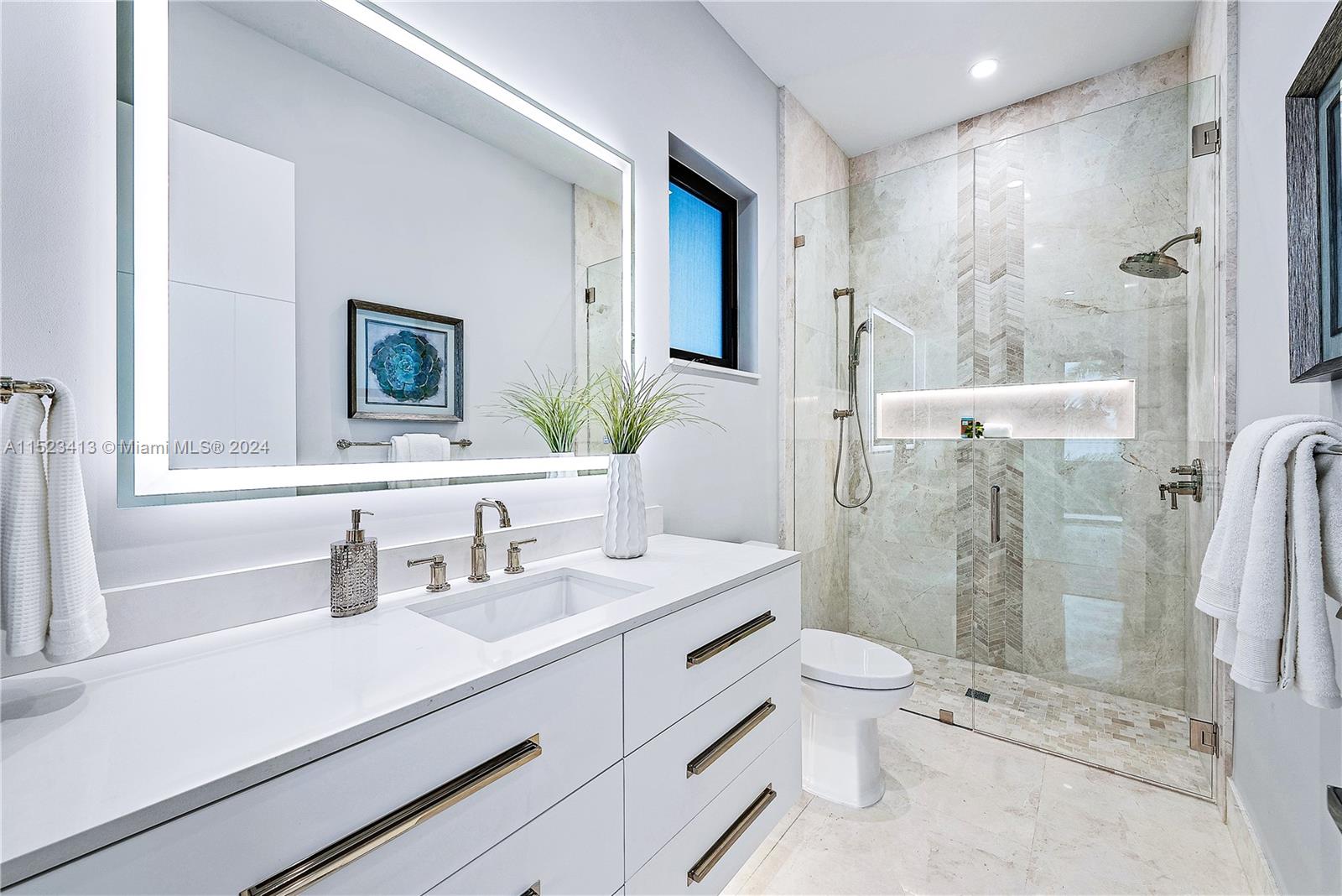 364 Northeast 6th Street Boca Raton, FL 33432 - Photo 49 of 80 a bathroom with a sink a toilet and shower