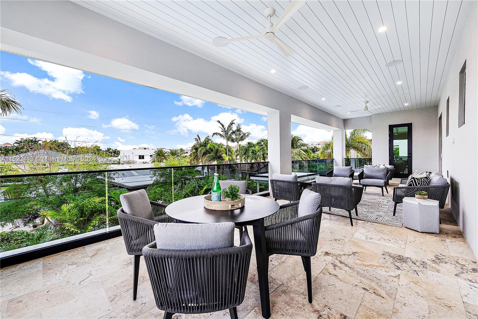 364 Northeast 6th Street Boca Raton, FL 33432 - Photo 50 of 80 a view of a patio with a dining table and chairs