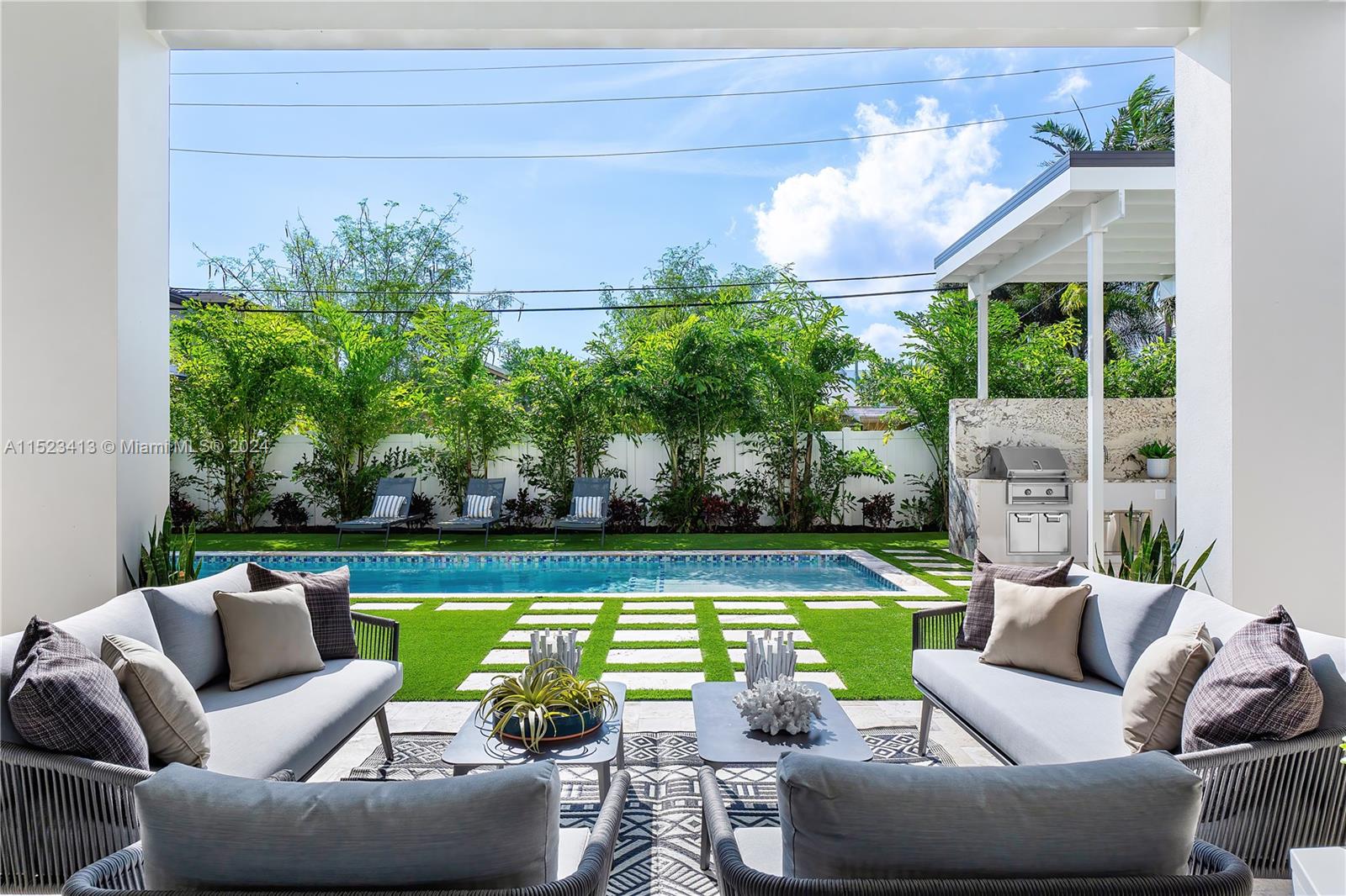 364 Northeast 6th Street Boca Raton, FL 33432 - Photo 67 of 80 a view of a patio with couches chairs and a yard