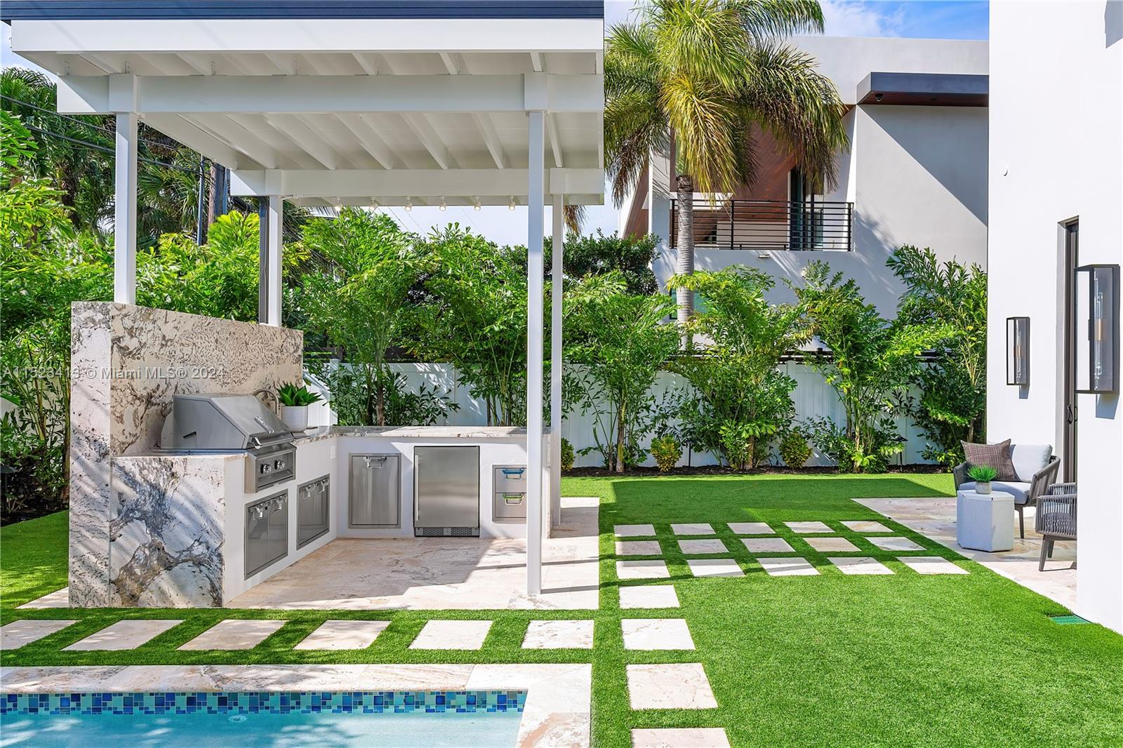 364 Northeast 6th Street Boca Raton, FL 33432 - Photo 71 of 80 a view of a house with a yard and potted plants