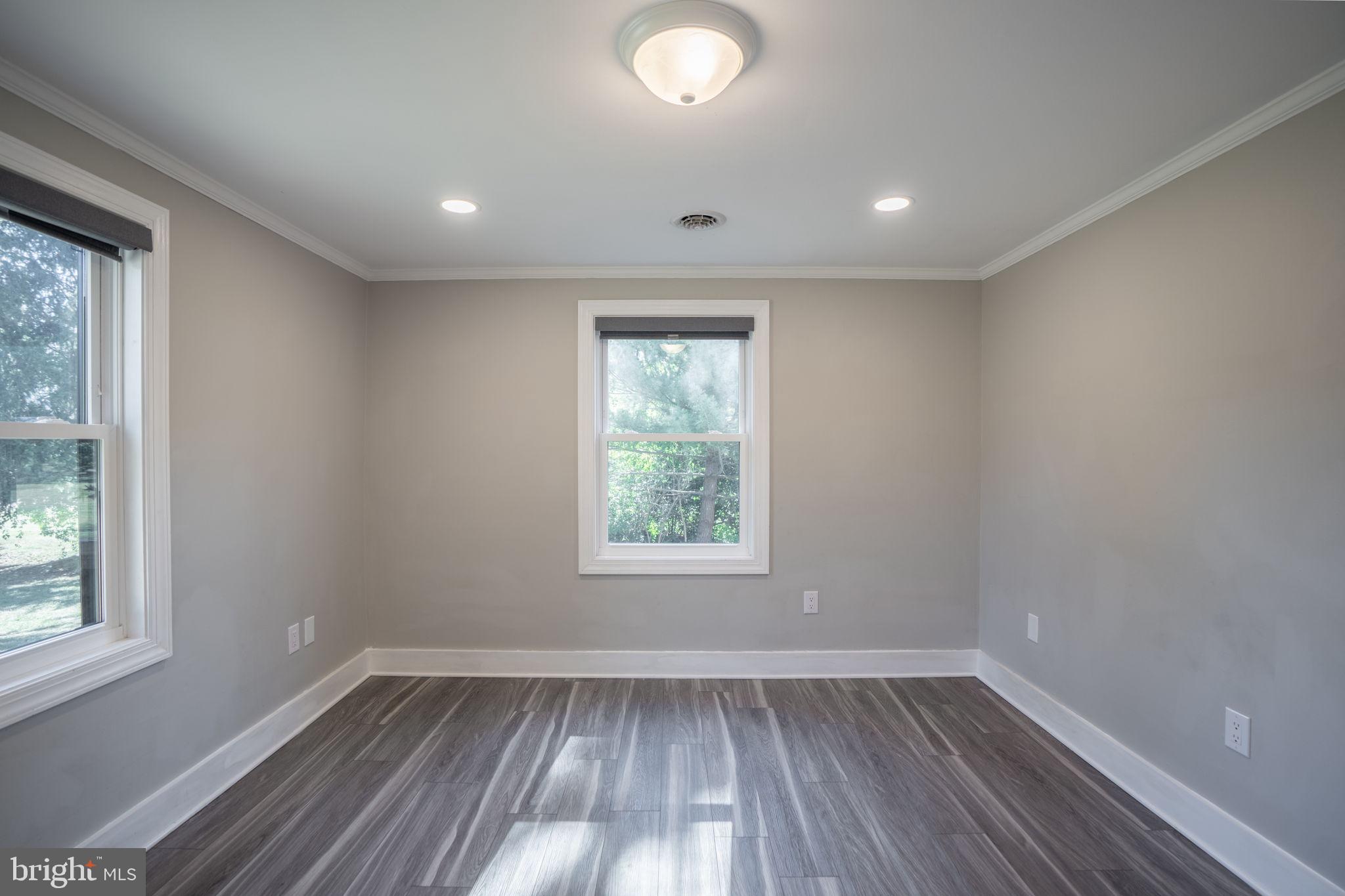 16809 Broadfording Road Hagerstown, MD 21740 - Photo 20 of 49 a view of an empty room with wooden floor and a window