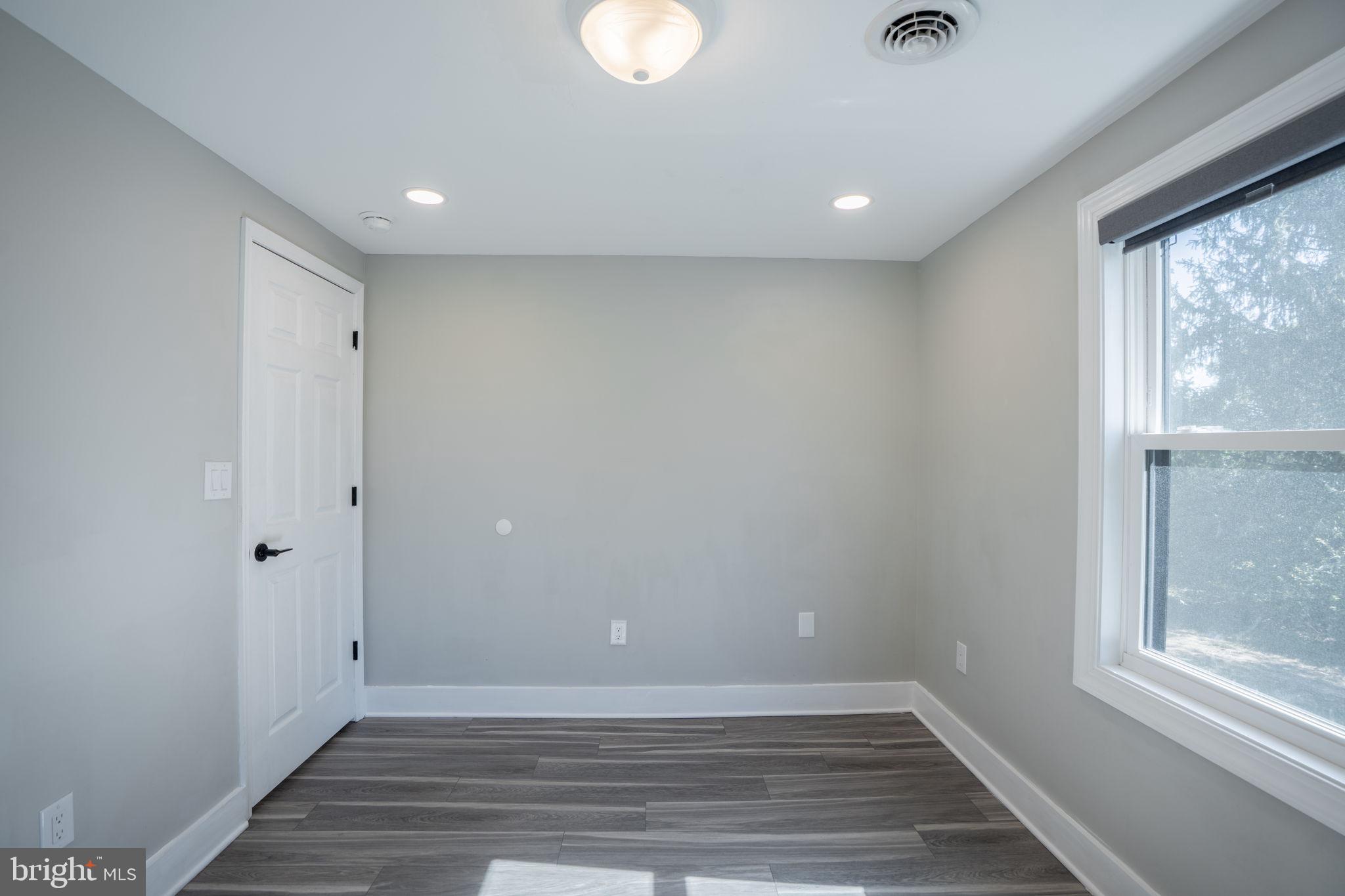 16809 Broadfording Road Hagerstown, MD 21740 - Photo 23 of 49 a view of an empty room with wooden floor and a window
