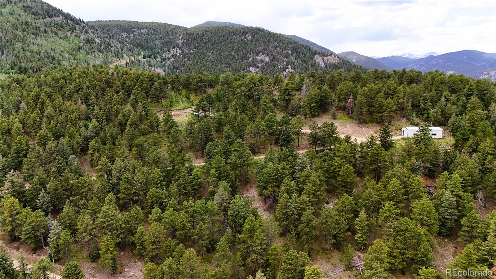 8077 Drew Hill Road Golden, CO 80403 - Photo 39 of 50 a view of a city with a mountain