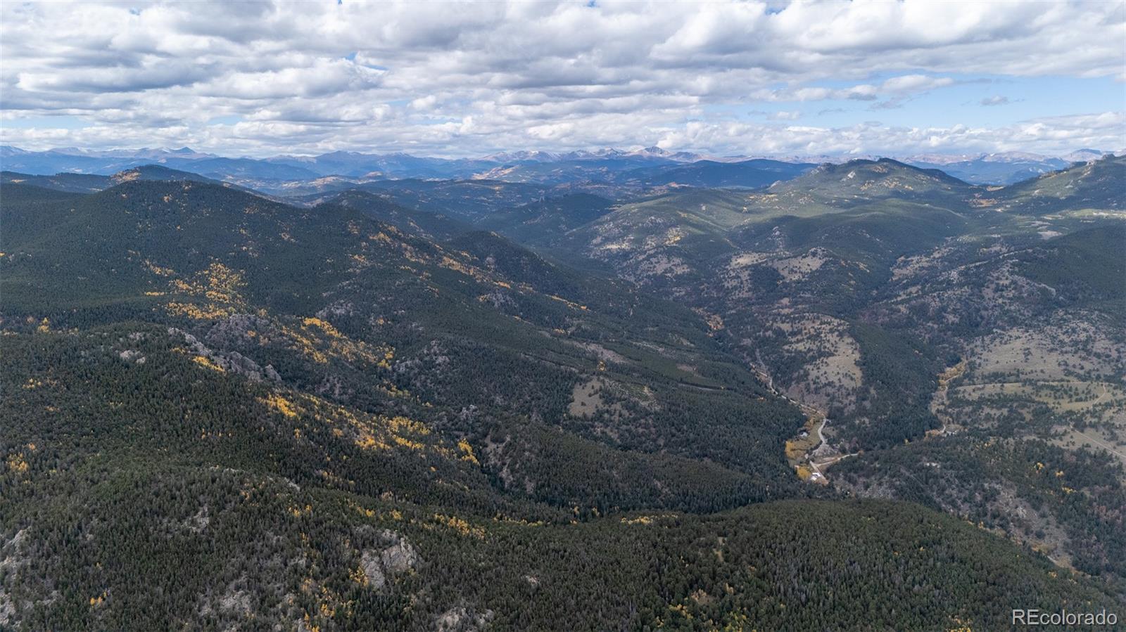 8077 Drew Hill Road Golden, CO 80403 - Photo 42 of 50 a view of a city of mountains