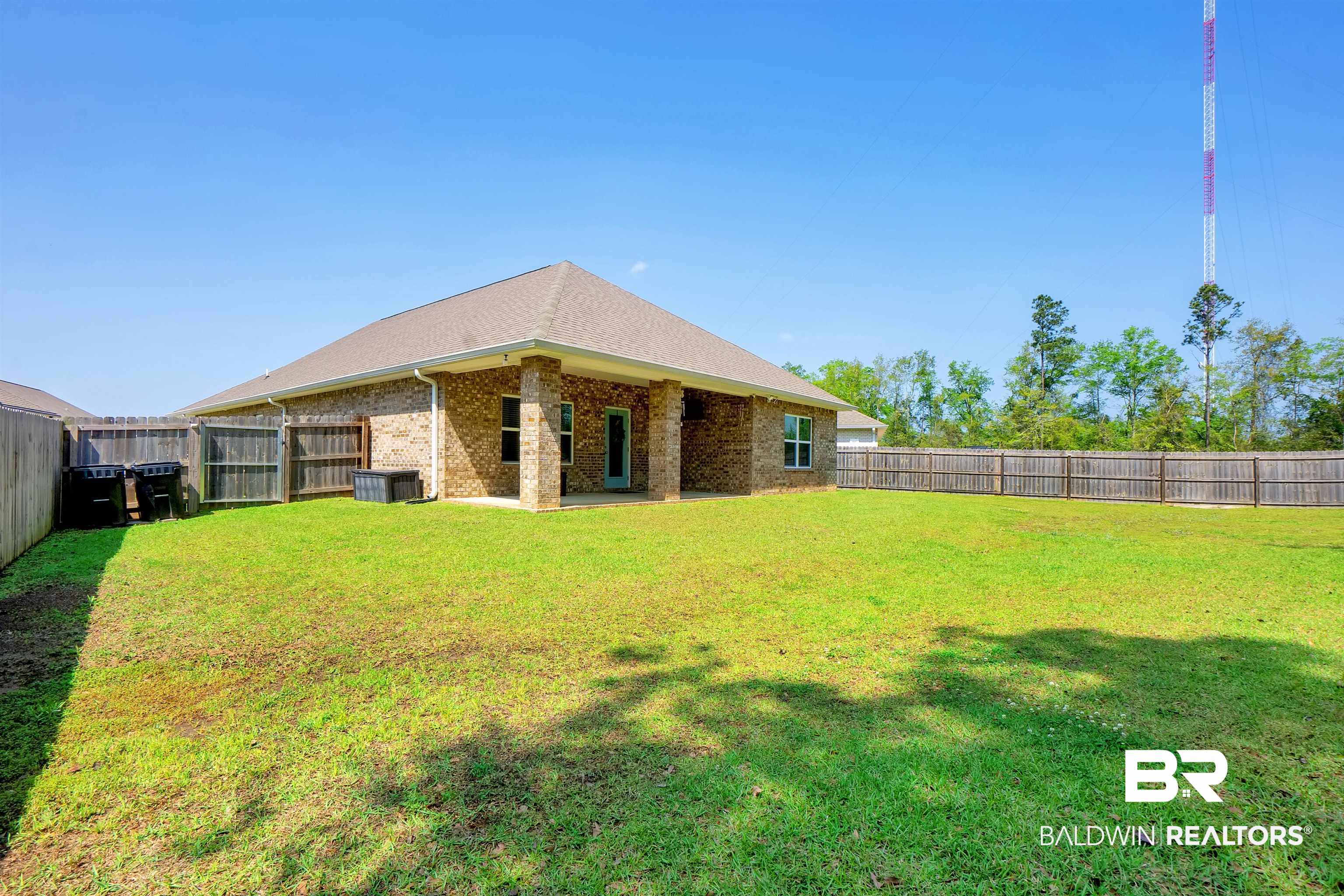 31671 Memphis Loop Daphne, AL 36527 - Photo 33 of 51 View of yard featuring a fenced backyard and central AC