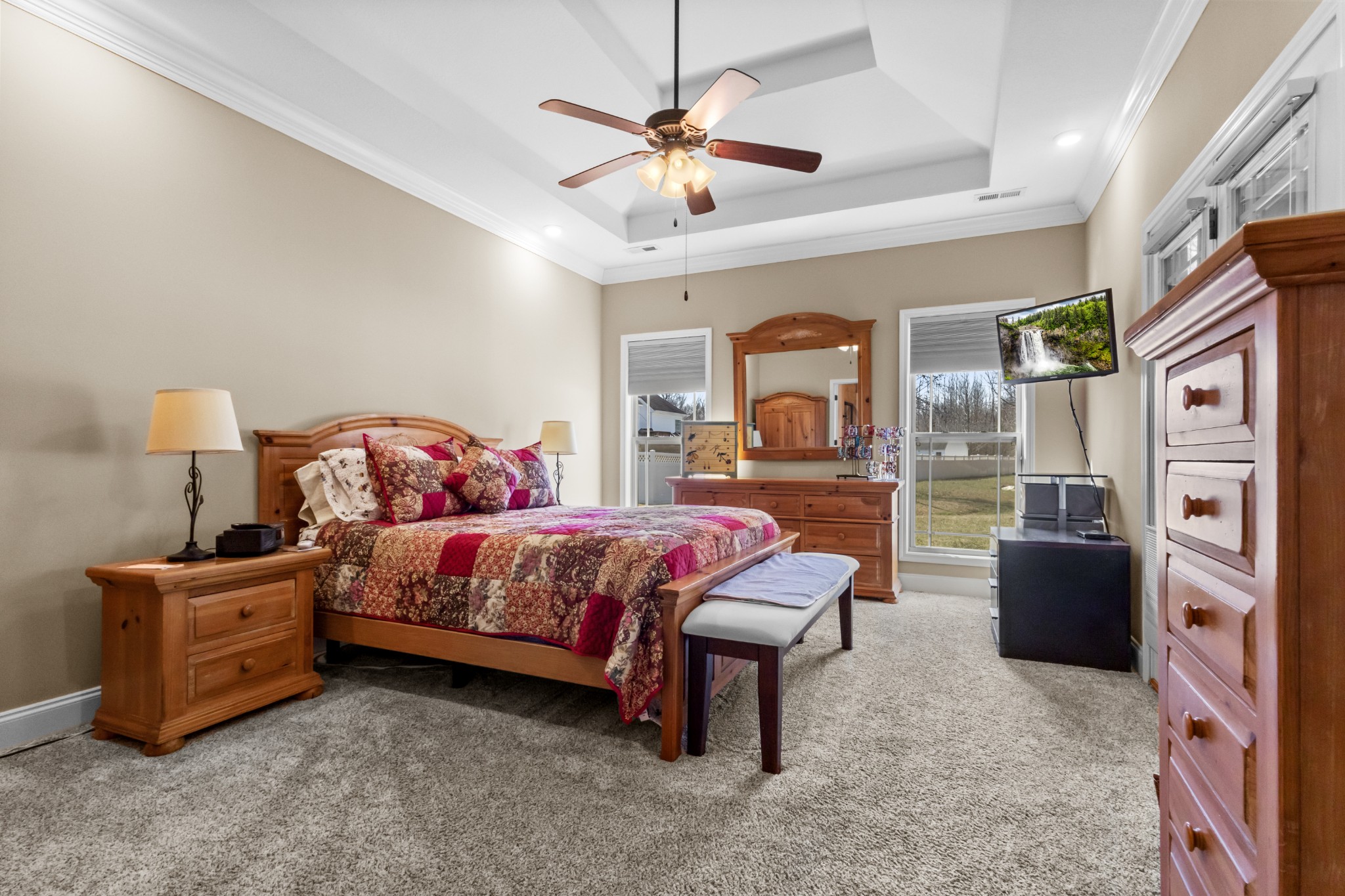 4268 Sango Road Clarksville, TN 37043 - Photo 14 of 32 a bedroom with a bed dresser and a chandelier