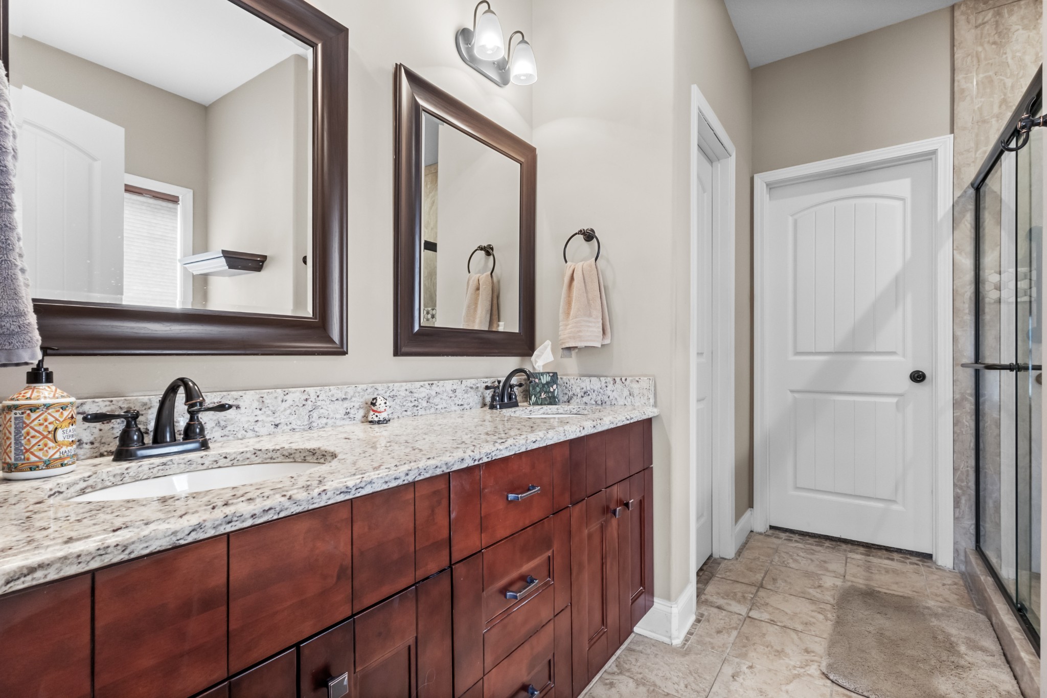 4268 Sango Road Clarksville, TN 37043 - Photo 15 of 32 a bathroom with a double vanity sink and a mirror