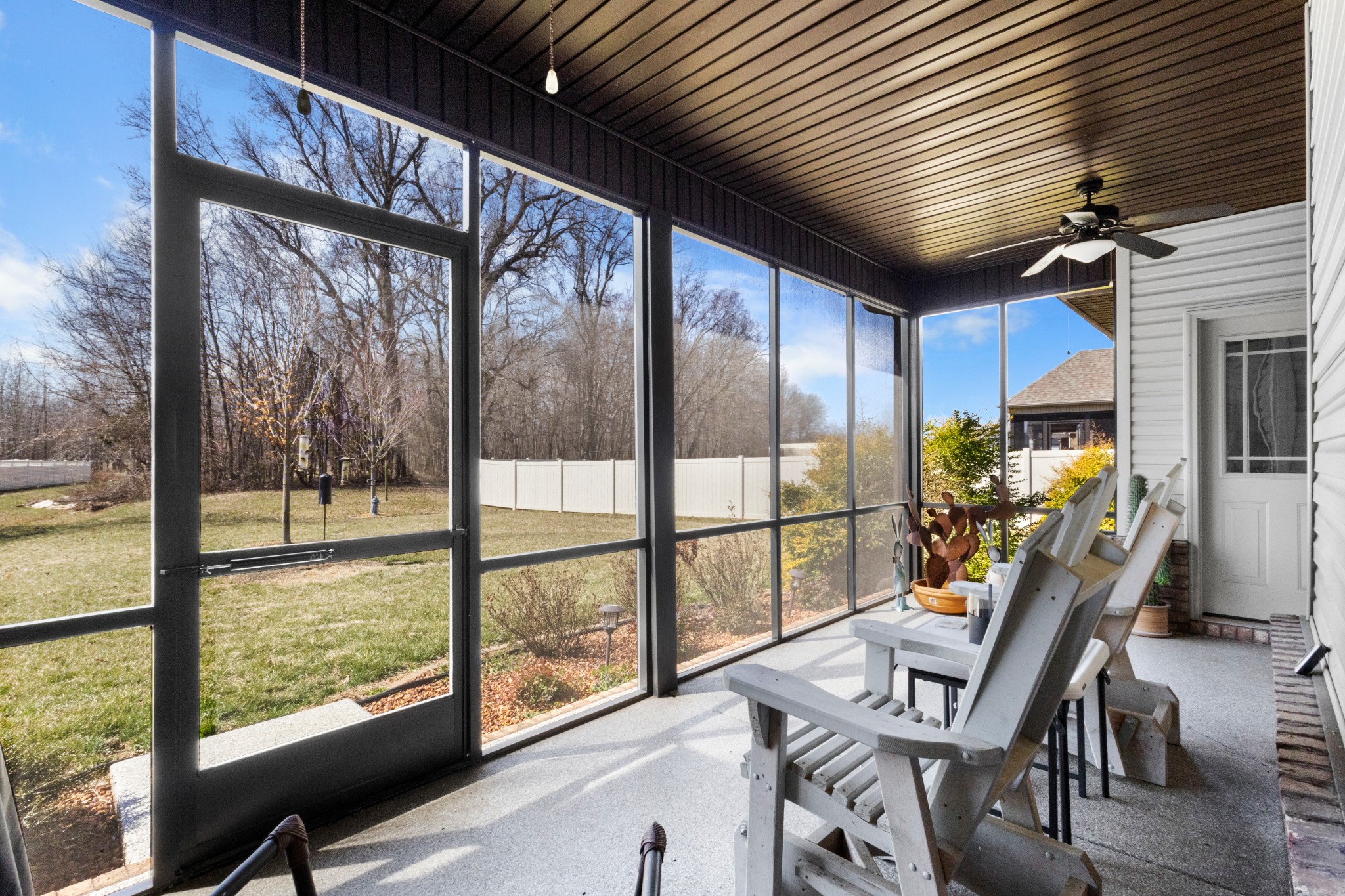4268 Sango Road Clarksville, TN 37043 - Photo 25 of 32 a view of a living room with furniture and floor to ceiling windows