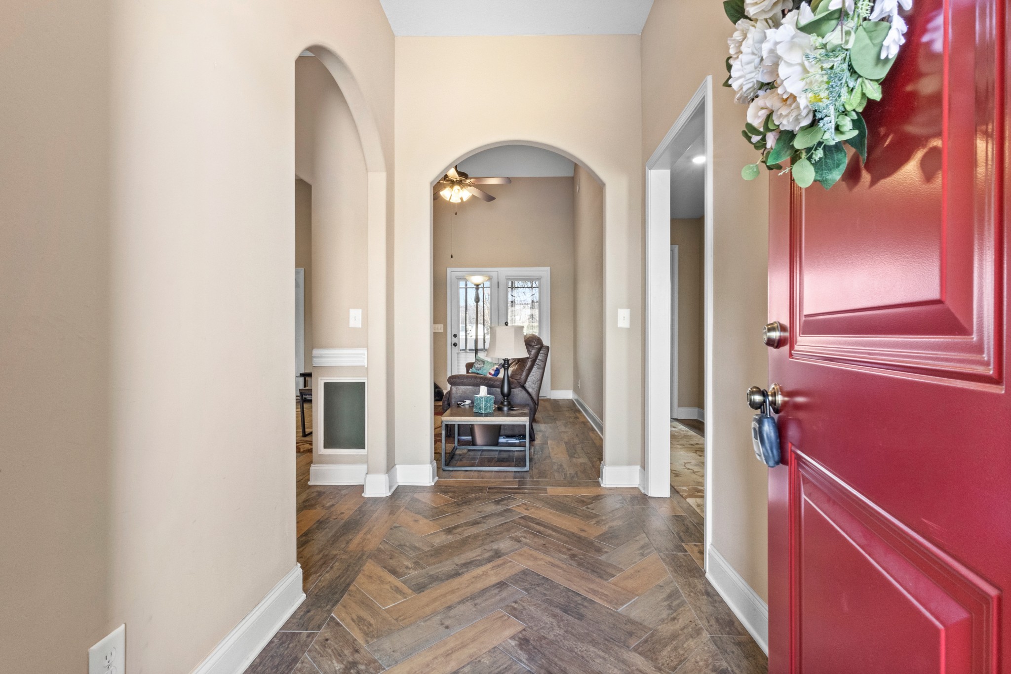 4268 Sango Road Clarksville, TN 37043 - Photo 5 of 32 hallway with wooden floor and a chandelier