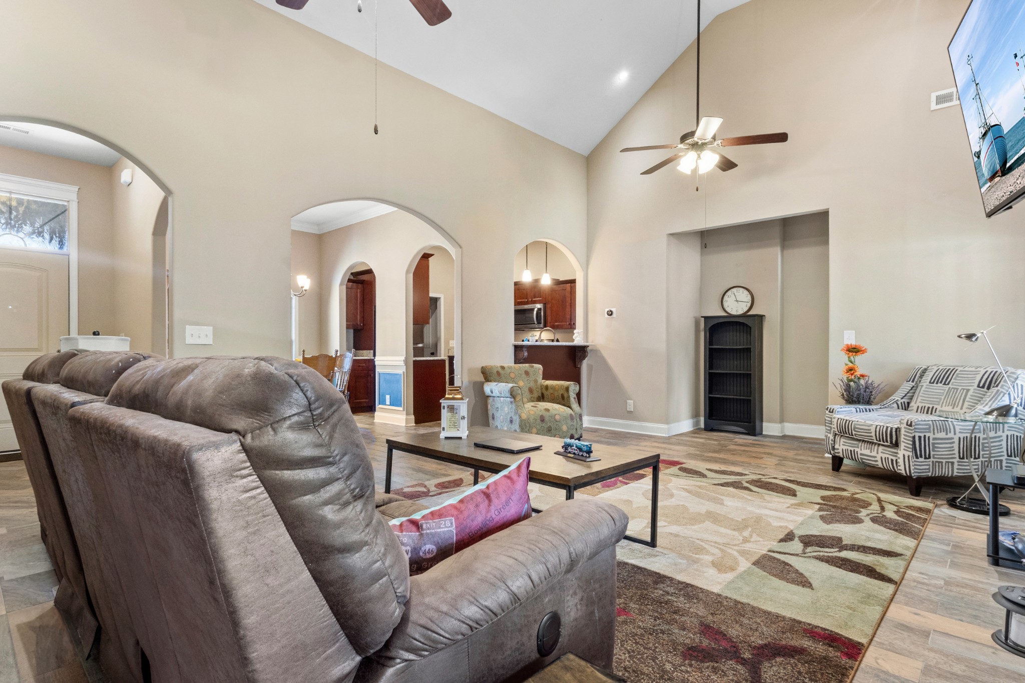4268 Sango Road Clarksville, TN 37043 - Photo 7 of 32 a living room with furniture and a chandelier