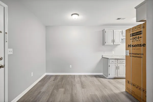 a view of kitchen with wooden floor