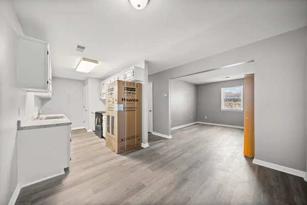 a view of a kitchen cabinets and wooden floor