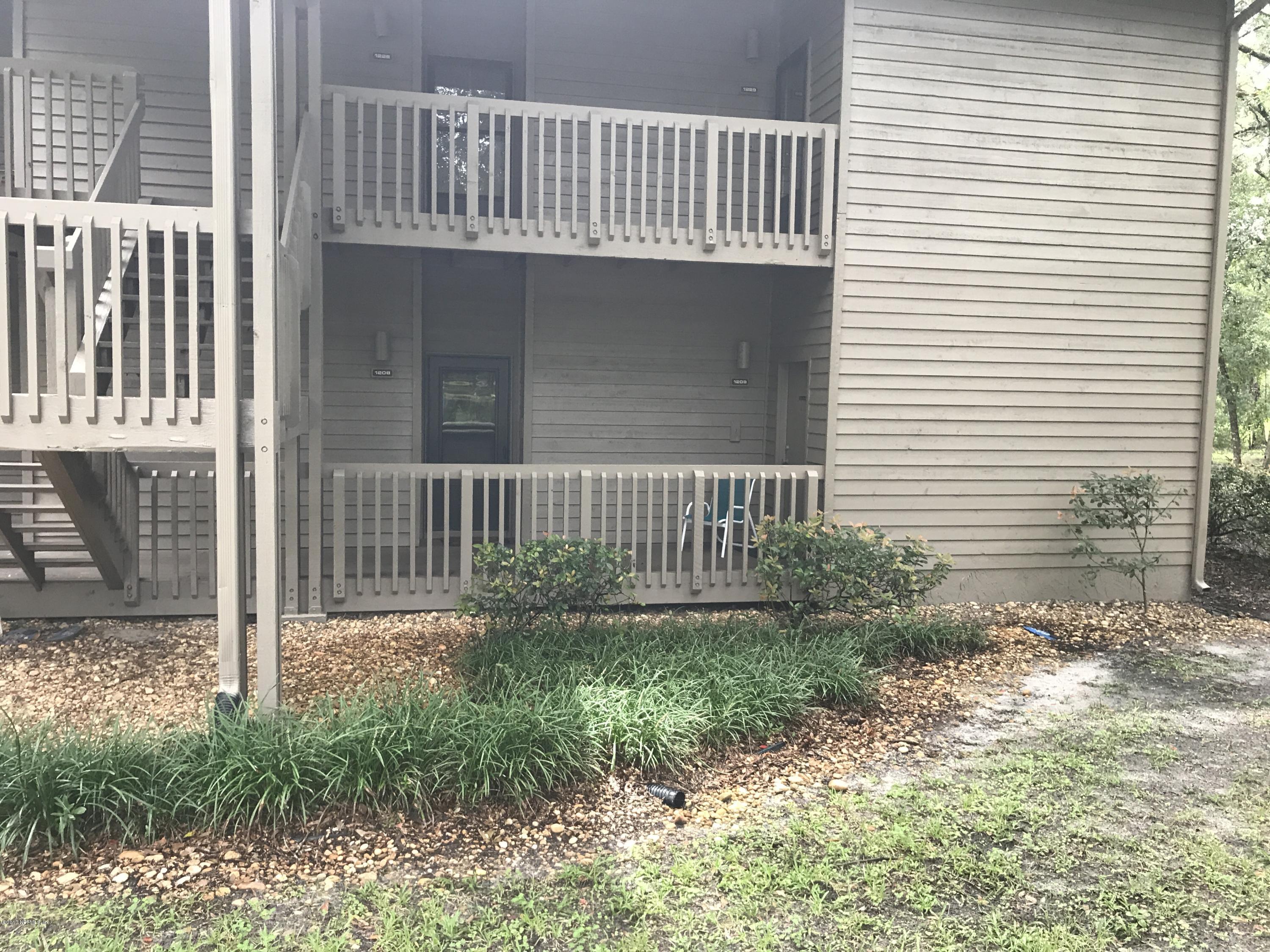 2930 Ravines Road, Unit 1208 Middleburg, FL 32068 - Photo 1 of 2 a view of a house with a small yard and wooden fence