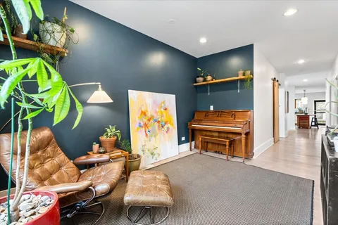 a room with furniture and a flat screen tv