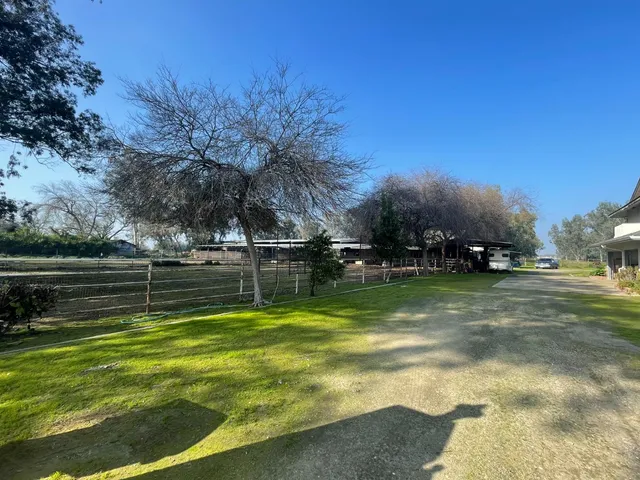 a view of a swimming pool with a yard