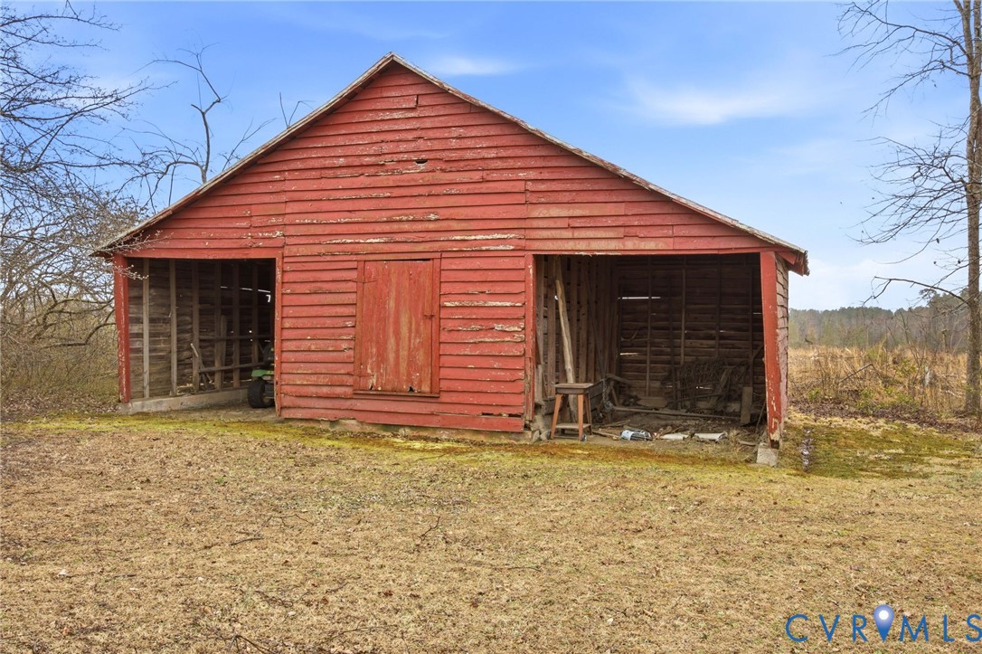 6184 Henderson Road Stony Creek, VA 23882 - Photo 16 of 30 a view of a house with a yard