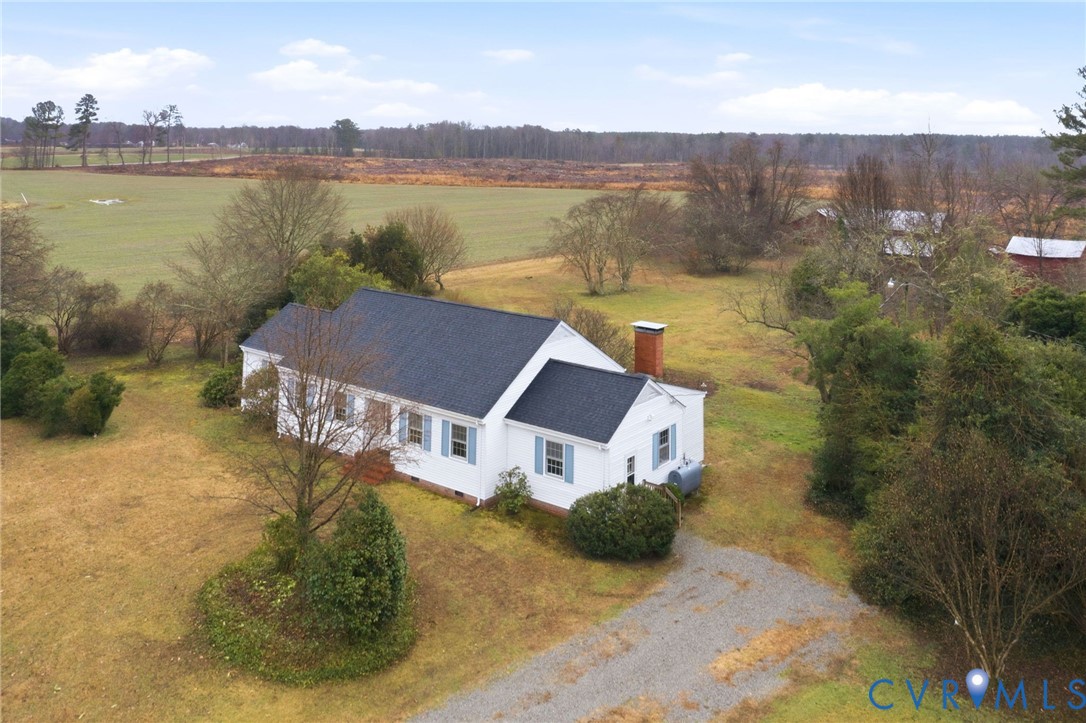 6184 Henderson Road Stony Creek, VA 23882 - Photo 2 of 30 a view of a lake with a house in the background