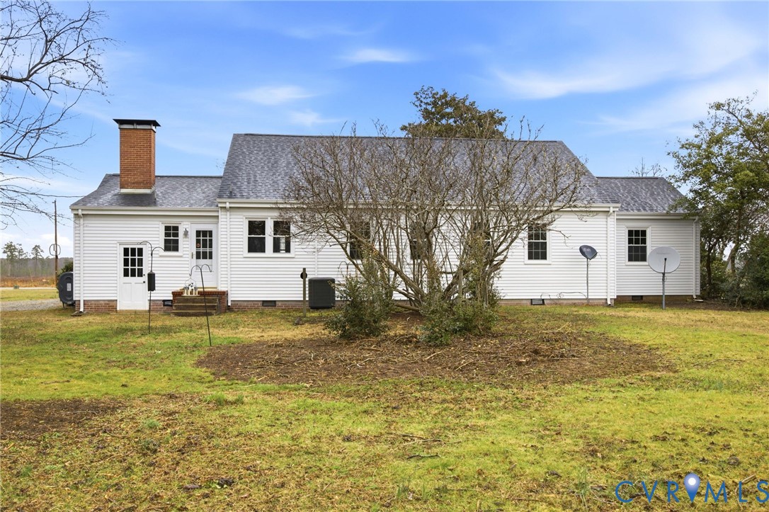 6184 Henderson Road Stony Creek, VA 23882 - Photo 22 of 30 a view of a big house with a big yard and a large tree
