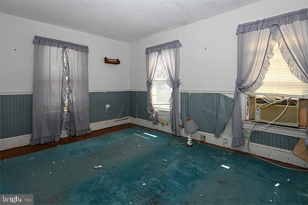 313 Sassafras Street Millville, NJ 08332 - Photo 19 of 25 wooden floor with window in an empty room