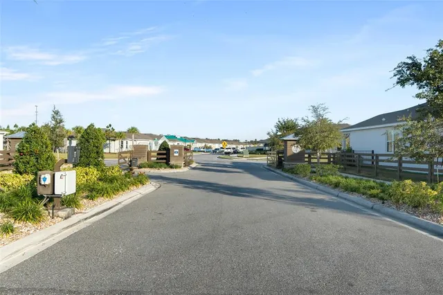 a view of a road with a building in the background