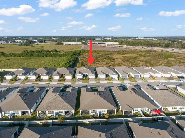 a view of houses with outdoor space and lake view