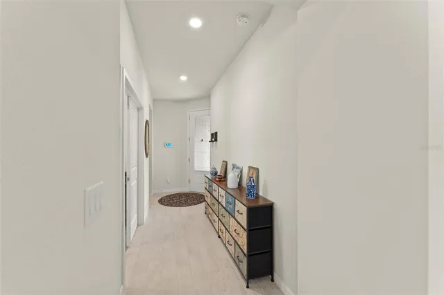 a view of a hallway with seating area