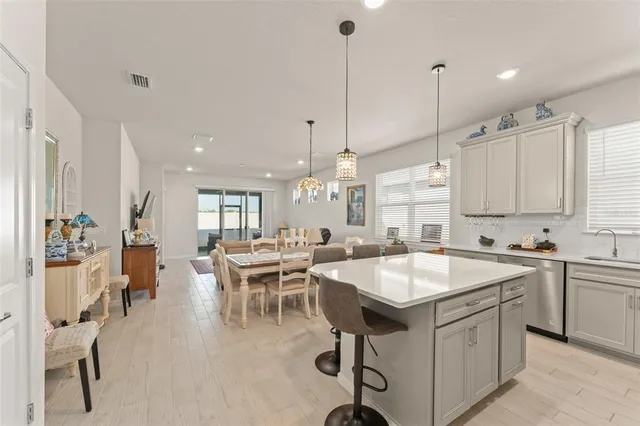 a very nice looking dining table with chairs