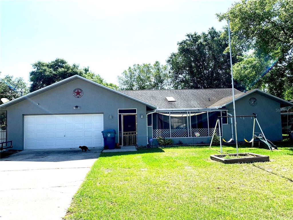 2028 Nobleton Avenue Spring Hill, FL 34608 - Photo 1 of 1 a view of a house with backyard and a tree