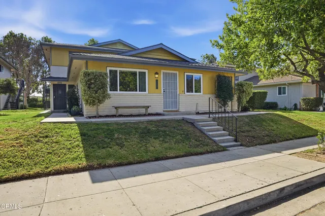front view of a house with a yard