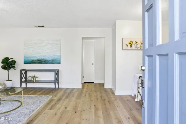a view of kitchen entrance and wooden floor