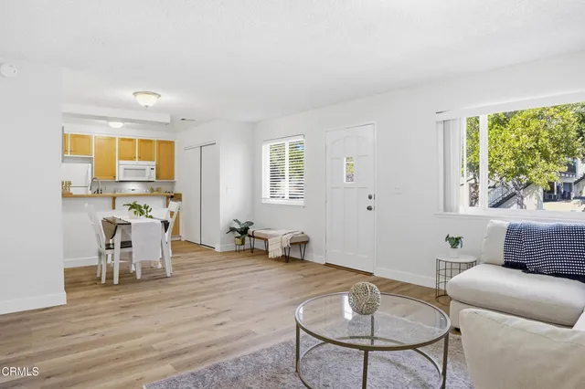 a living room with furniture and a table