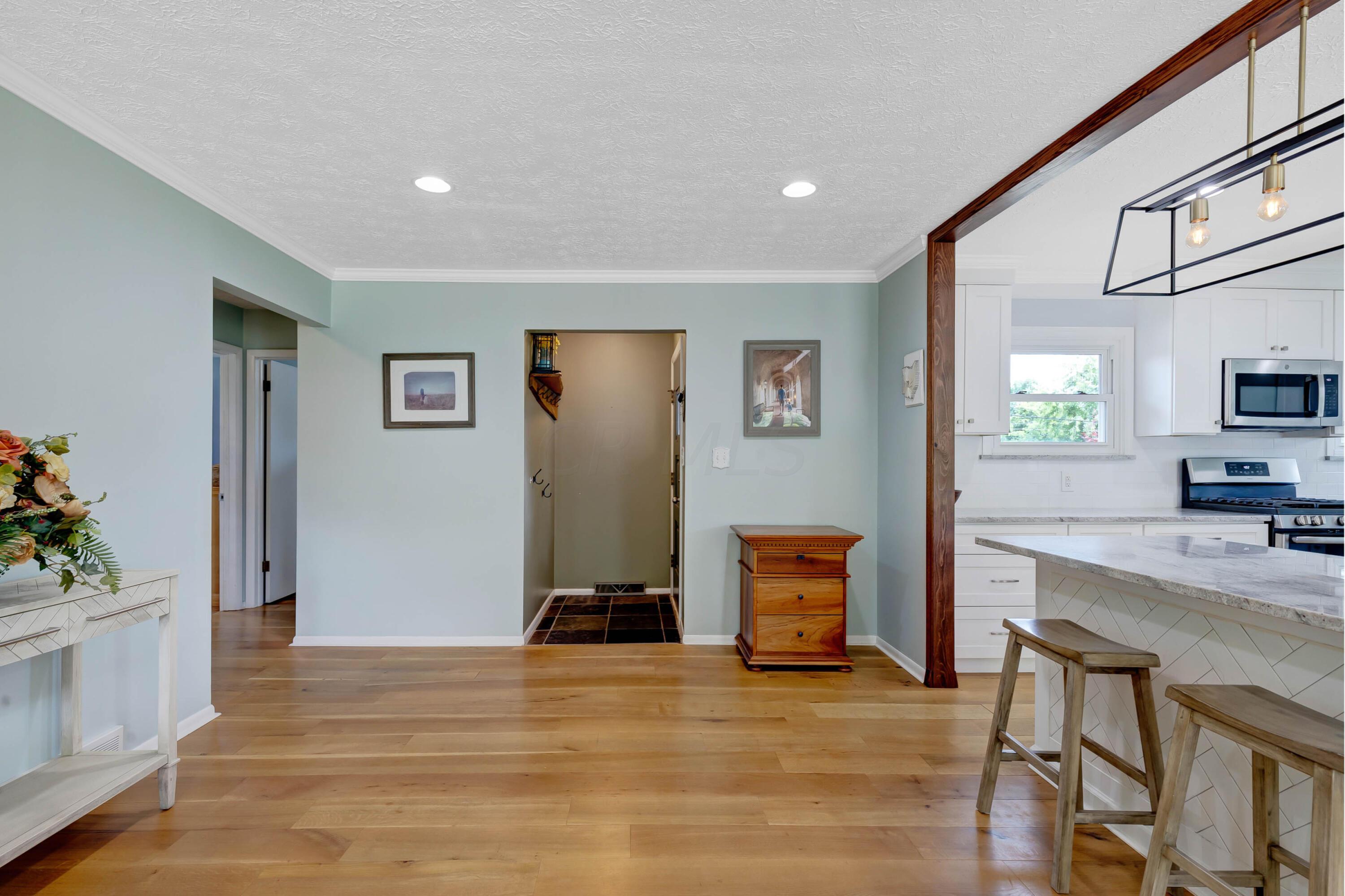 3324 Sunbury Road Galena, OH 43021 - Photo 6 of 56 • New White Oak Flooring ~ 2014/2015 • Sage Painted Walls • Crown Molding • Can Lighting • Large Picture Window