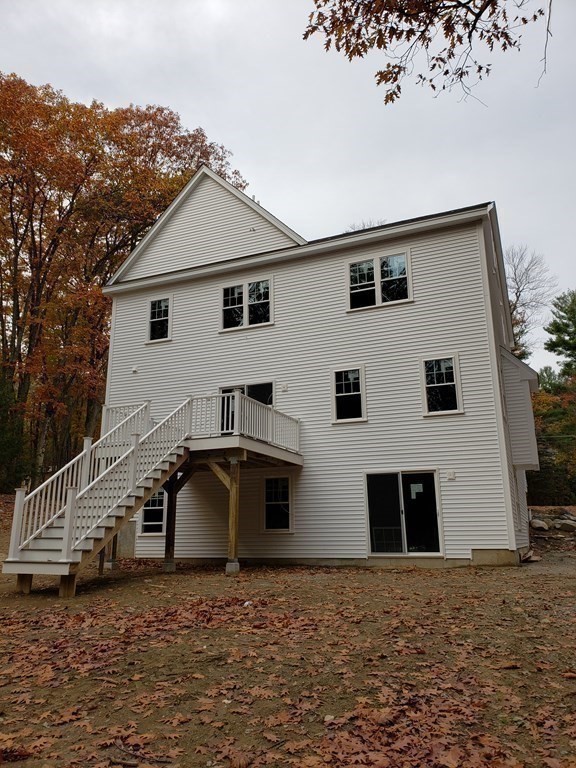 166 Pepperell Road Groton, MA 01450 - Photo 18 of 22 a house with trees in the background