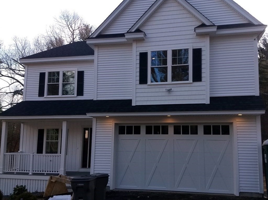 166 Pepperell Road Groton, MA 01450 - Photo 3 of 22 a front view of a house with a balcony