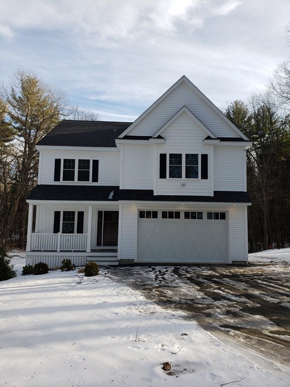 166 Pepperell Road Groton, MA 01450 - Photo 4 of 22 a front view of a house with a yard