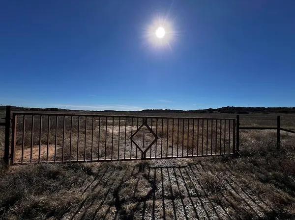 a view of a backyard of the house