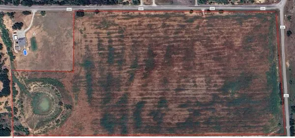 a street sign on a sidewalk next to a road