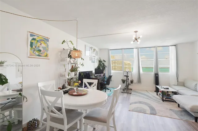 a view of a dining room with furniture window and outside view