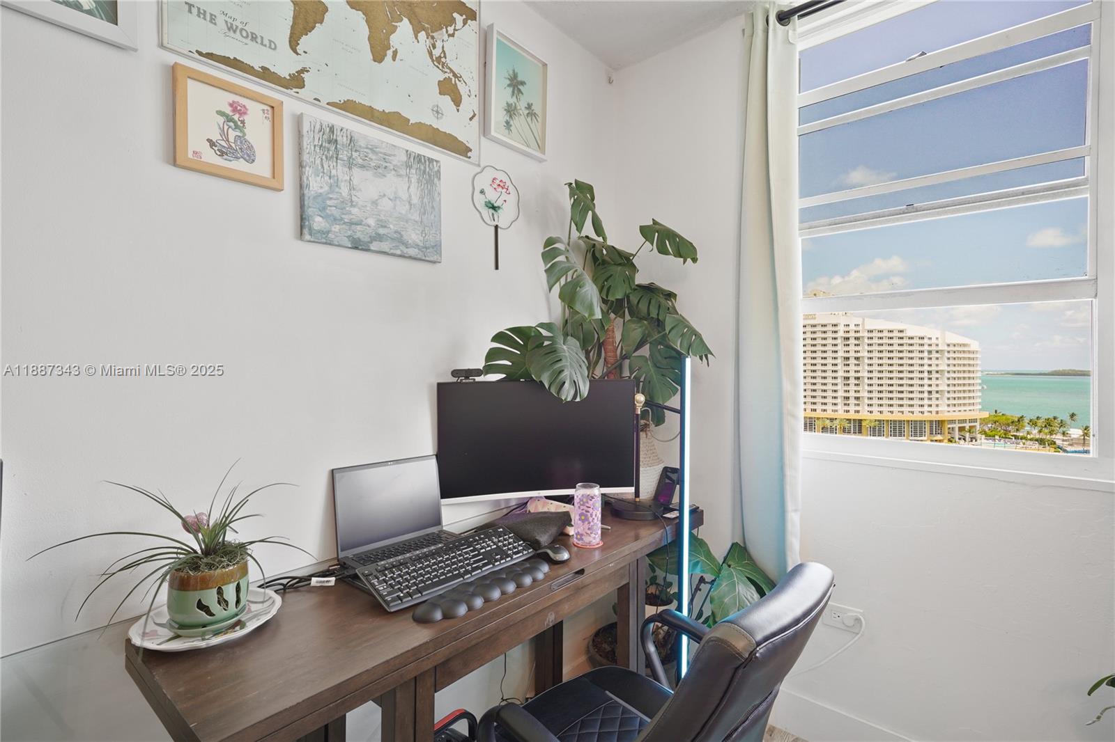 801 Brickell Bay Drive, Unit 1569 Miami, FL 33131 - Photo 6 of 19 a view of a workspace with furniture