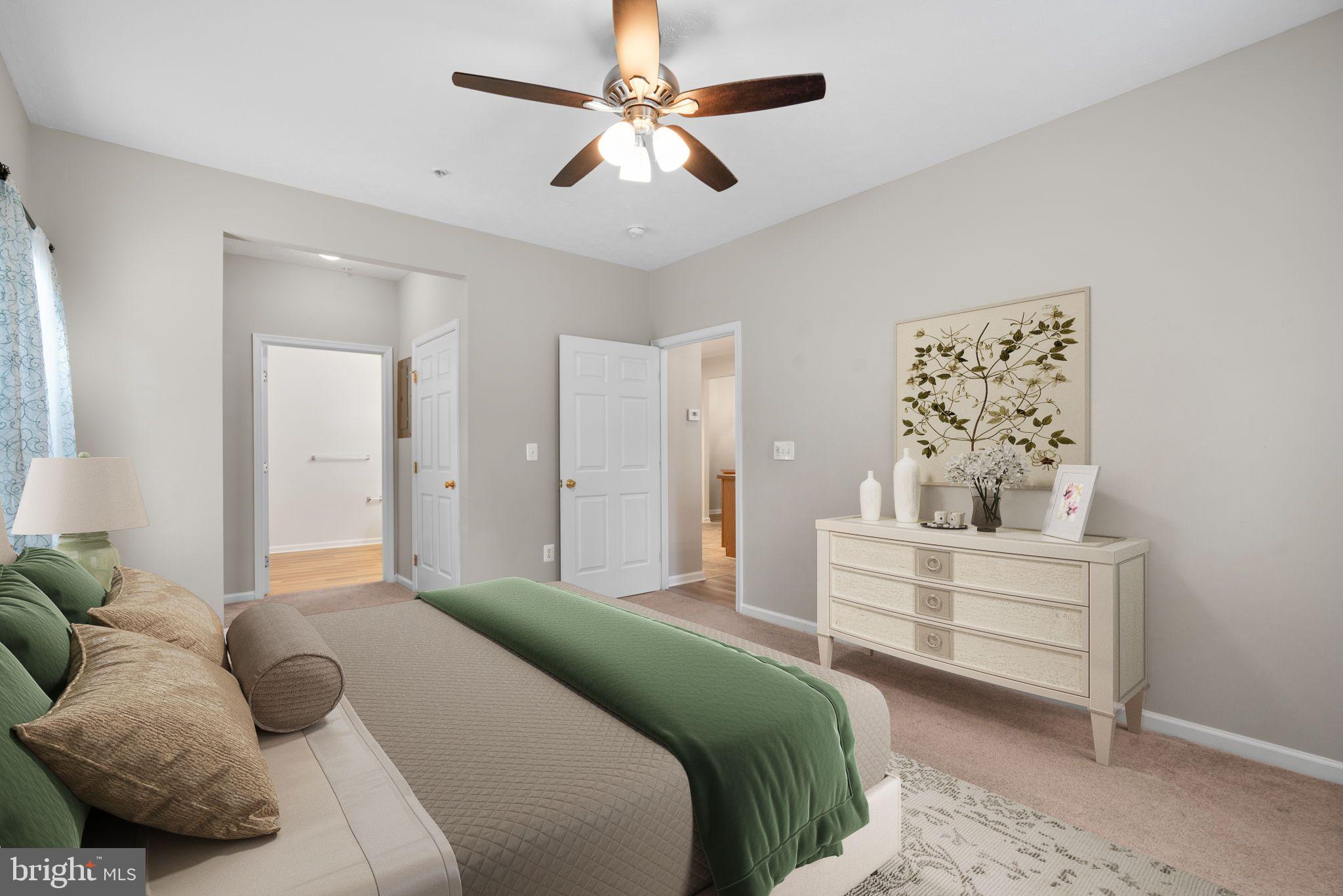 5215 Glenthorne Court, Unit 5215 Rosedale, MD 21237 - Photo 15 of 22 a bedroom with a bed couches and window