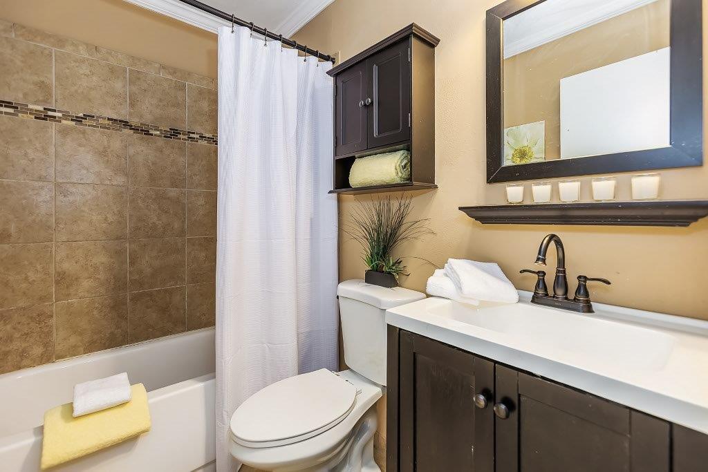 2329 Foothill Road, Unit 1 Pleasanton, CA 94588 - Photo 12 of 15 a bathroom with a sink a toilet and shower