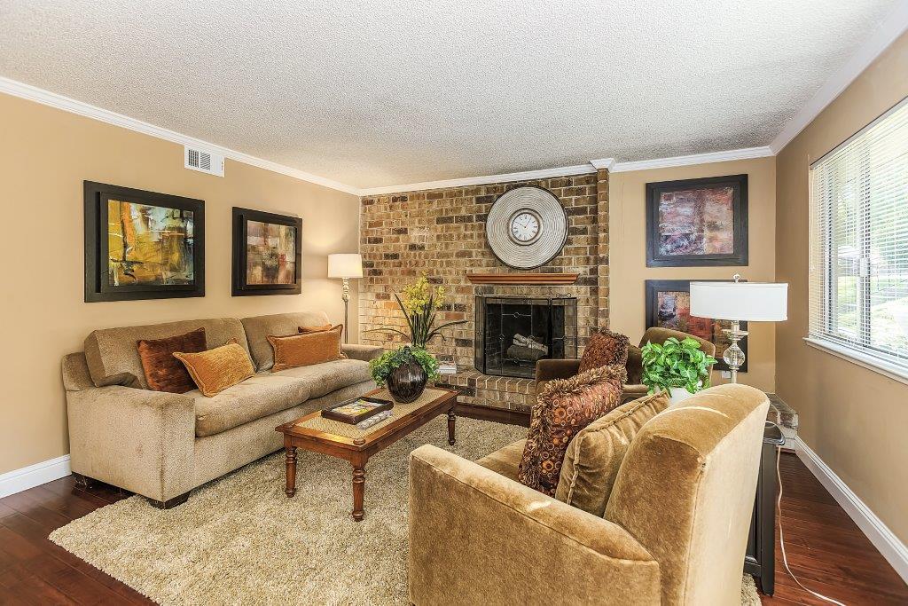 2329 Foothill Road, Unit 1 Pleasanton, CA 94588 - Photo 4 of 15 a living room with furniture and a fireplace