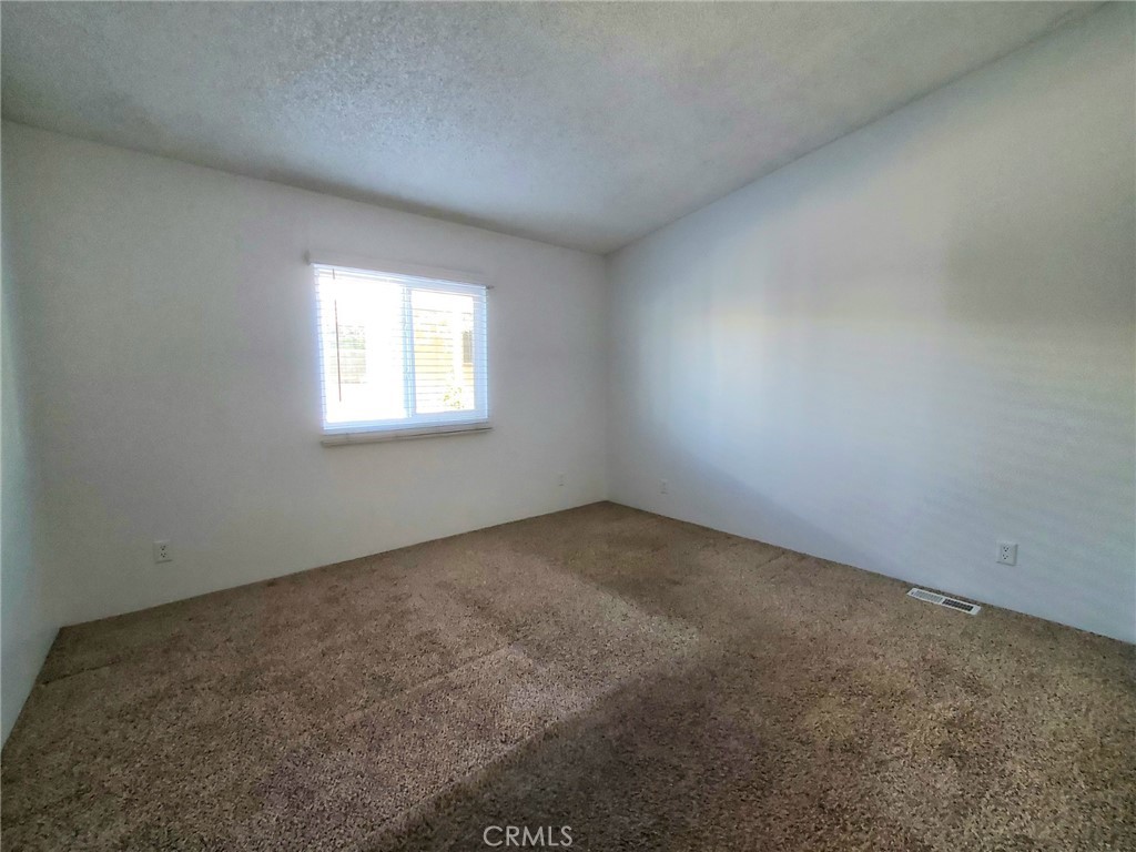 29021 Bouquet Canyon Road, Unit 213 Saugus, CA 91350 - Photo 12 of 17 an empty room with a window
