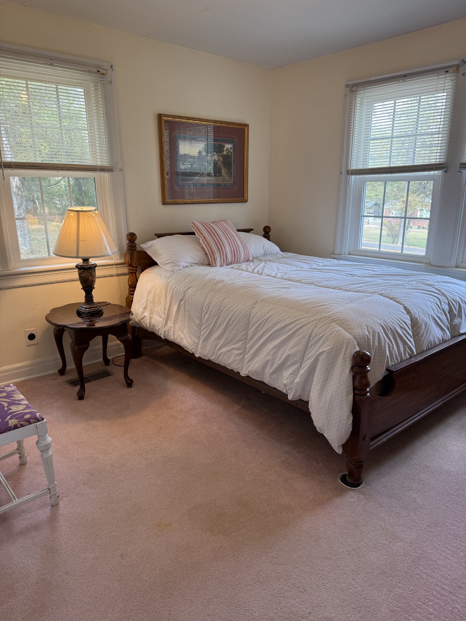 752 Florence Circle Madison, TN 37115 - Photo 21 of 59 a spacious bedroom with a bed and lamp next to a window