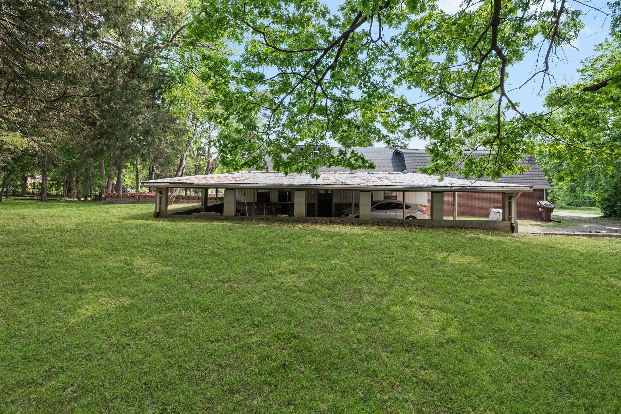 752 Florence Circle Madison, TN 37115 - Photo 33 of 59 a front view of a house with a garden and trees