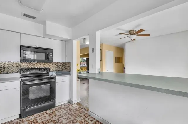 a kitchen with a stove and a sink