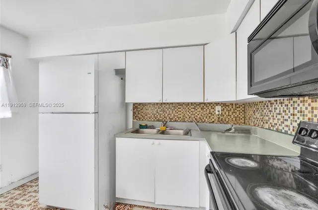 a bathroom with a sink and a washing machine