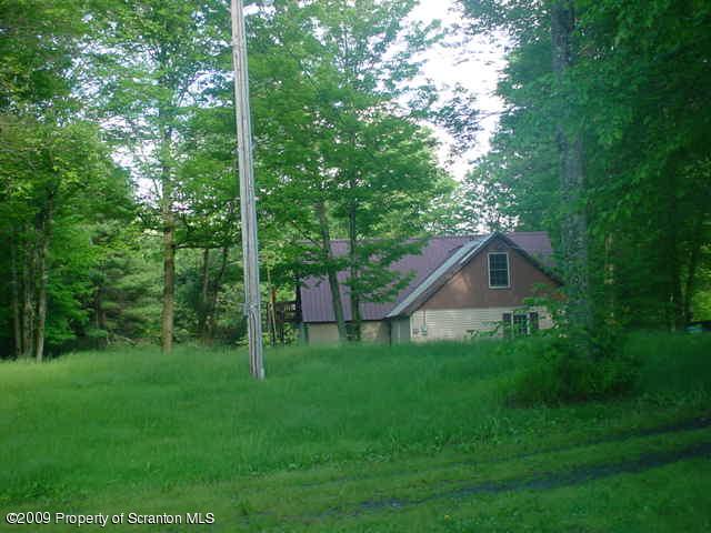 Rr Springville, PA 18844 - Photo 6 of 11 a view of a house with backyard and garden