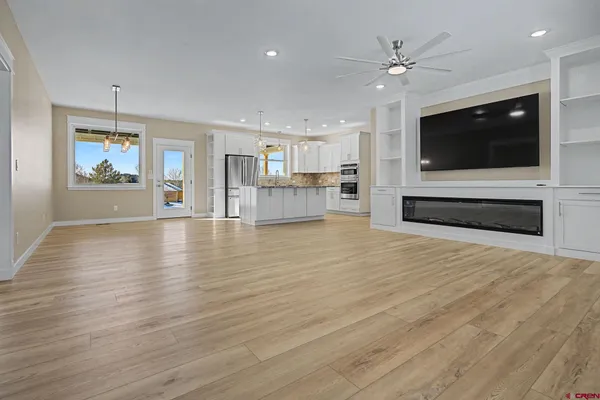 a view of dining room with furniture wooden floor and chandelier
